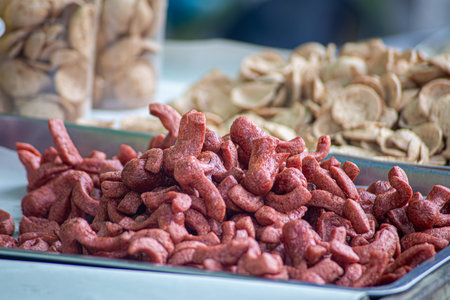 Traditional Thai Fried Sausage at Local Street Food Market Close-Up of Fermented Pork Sausage...