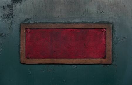 Vintage red metal plate on the old train. Textured background. Close shot. Can be used as a retro...