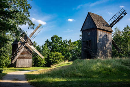 Two old wooden windmills in an open-air museum The Opole Village, Poland, 20 June 2021のeditorial素材