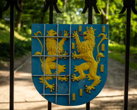 The coat of arms on the entrance gate to the Kamieniec Zabkowicki palace. Poland, 4.07.2021.