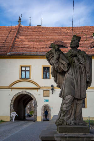 SaintÂ John of Nepomuk (Jan Nepomucen) stone figure in the entrance way to medieval cistercian...
