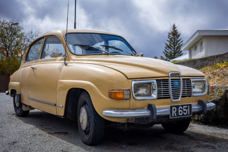 HAFNARFJORDUR, ICELAND - July 16, 2021: Light beige classic car Saab 96, years of production 1969-74.のeditorial素材