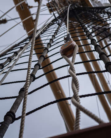 REYKJAVIK, ICELAND - June 11, 2021: A traditional wooden block and rigging ropes on the deck of US coastguard tallship Eagle visiting Reykjavik Harbour.のeditorial素材