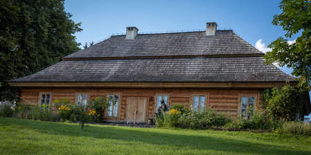 CIEKOTY, POLAND - July 29, 2021:
A traditional wooden house in Ciekoty, Swietokrzyskie Mountains. Reconstructed home and museum of a famous Polish writer Stefan Zeromski.のeditorial素材