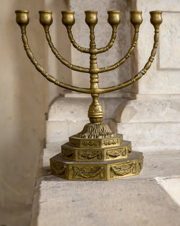 A golden menorah. Seven-lamp (six branches) ancient Hebrew lampstand.の写真素材