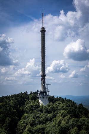 Swiety Krzyz - July 29, 2021:
A radio mast on the top of Holy Cross mountain. Swietokrzyskie Mountains, Poland. Â Green forest, cloudy sky.のeditorial素材