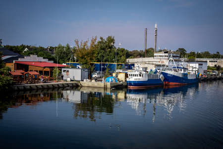 Dziwnow, Poland - September 10, 2021: Fishing boats in the harbour.のeditorial素材