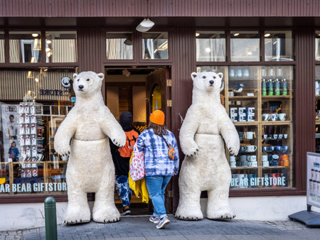 Reykjavik, Iceland - June 12 2021: Entrance to a gift store at Laugavegur street. Two stuffed white...