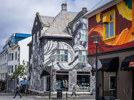 Reykjavik, Iceland - June 12 2021: Colorful houses at Laugavegur street in Reykjavik downtown. People walking down the street.のeditorial素材