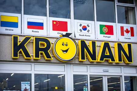 Hafnarfjordur, Iceland - September 05, 2021: A glass facade and yellow logo of Kronan supermarket.のeditorial素材