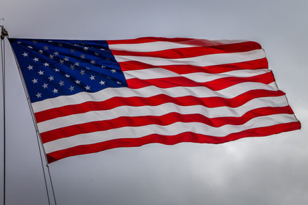 A national flag of United States of America, fluttering in the wind.
