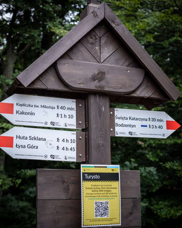 Lysica, Poland - July 28, 2021:Â  Tourist trail board signs on the top of Lysica Mountain, the highest peak in the Swietokrzyskie Mountains.のeditorial素材