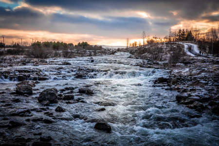 Winter sunset over the Ellidaa river in Reykjavik, Iceland.の写真素材