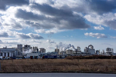 Wroclaw, Poland - February 19, 2022: Smoking chimneys of Cargill food corporation factory.のeditorial素材