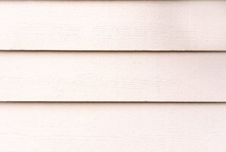 Light pink wooden background with copyspace. Wall of an old cottage.