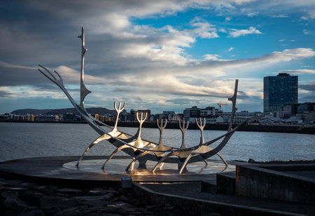 Reykjavik, Iceland - November 10, 2022: The Sun Voyager, a steel sculpture of a Viking long-ship by Jon Gunnar Arnarson on Reykjavik waterfront. Sunny day, blue sky.のeditorial素材