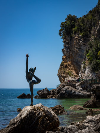 Budva, Montenegro - April 28, 2022: A dancing girl (Statua Ballerina)Â  bronze sculpture on the rocky coast of Adriatic sea.のeditorial素材