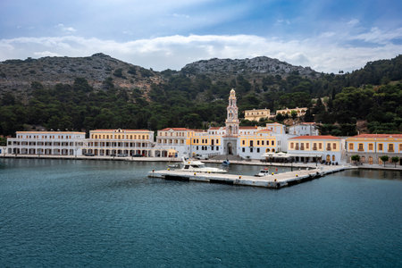 Symi, Greece - May 30, 2023: Monastery of Archangel Michael on the sea front of Panormitis village.