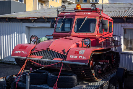 Reykjavik, Iceland - September 25, 2023: Red rescue caterpillar tractor vehicles in front of...