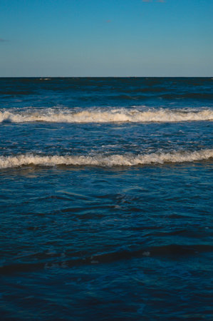 Seascape wave of the sea on the sandy beach