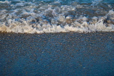 Seascape wave of the sea on the sandy beach