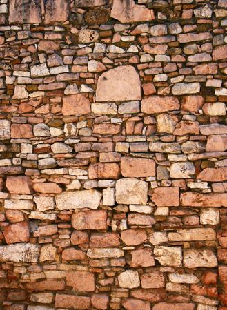 Old brick wall background in medieval italian town Assisi の写真素材