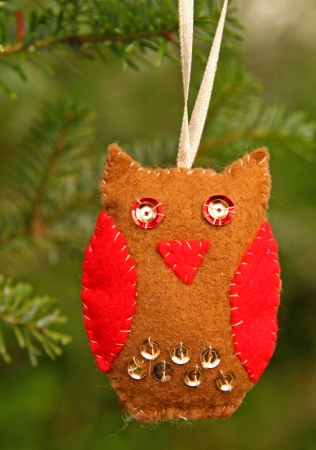 Hand made owl, Christmas decoration, hanging on the firの写真素材