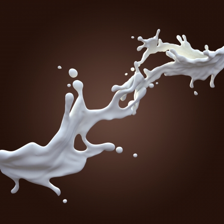 liquid milk splash isolated on dark backgroundの写真素材