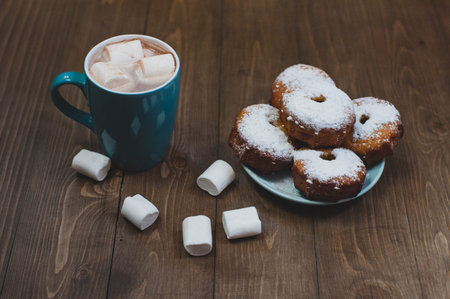 Cake with powdered sugar and cacao with marshmallowの写真素材