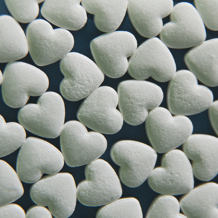 white hearts background macro pillsの写真素材