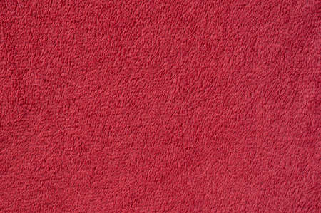 Plush red texture. Macro photo. Fabric backgroundの写真素材