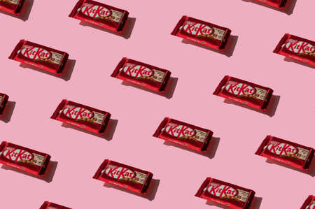 Krakow, Poland - 13 May 2021. Pattern of Kitkat chocolate on pink background.のeditorial素材