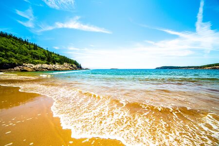 Waves and blue skies on Sand Beach, Acadia National Park, Maine, USAの写真素材