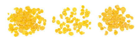 Top view of golden yellow crunchy corn flakes cereal heap set isolated on white background.の写真素材