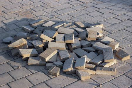 Construction pavement stones and bricks on terrace, road or sidewalk on the city street.の写真素材