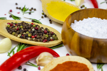 Variety of spices and seasonings (indian curry, different pepper, paprika powder, salt, dry ginger...