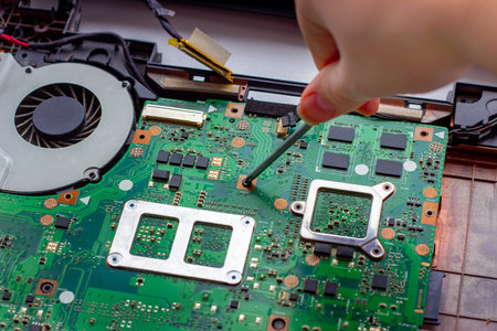 Fixing electronic components with the screwdriver inside the pc. Computer hardware, service, upgrade...