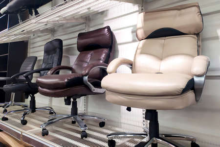 Different computer gamer soft ergonomic chairs in the furniture store.の写真素材