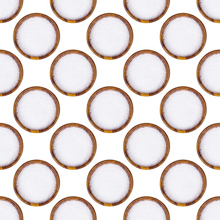 Top view of sea salt seasoning in brown wooden bowl seamless pattern on light background.の写真素材