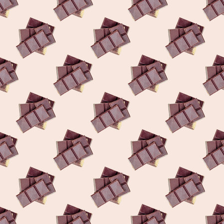 Sweet dark chocolate pieces repeat seamless pattern on light background.