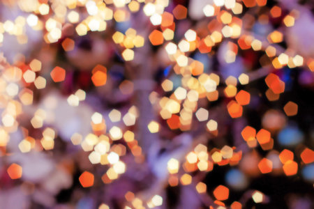 Blurred lights abstract background in the night, defocused dark glowing bokeh backdrop, magical...