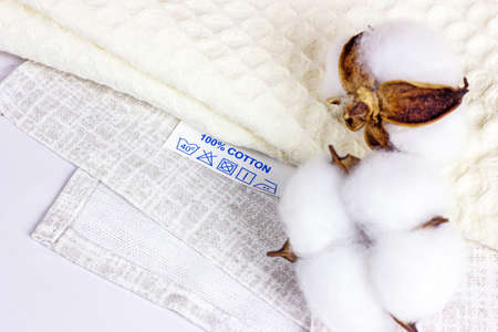 Pure natural light shades cotton fiber fabric with cloth label.の写真素材
