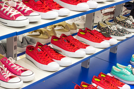 MINSK, BELARUS - MARCH 22, 2021: New sport footwear on the retail clothing shop display shelf.のeditorial素材