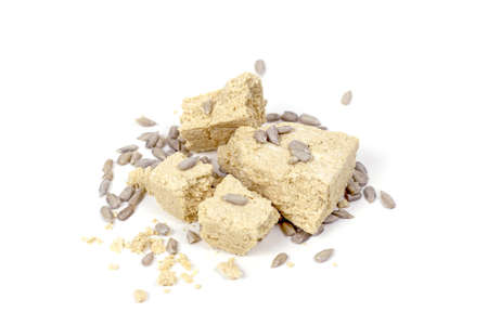Traditional sweet turkish delight halva pieces with sunflower seeds isolated on white background.の写真素材