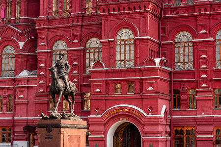 MOSCOW, RUSSIA - AUGUST 10, 2021: Red brick Russian State Historical Museum facade with the monument to Marshal Georgy Zhukov.のeditorial素材