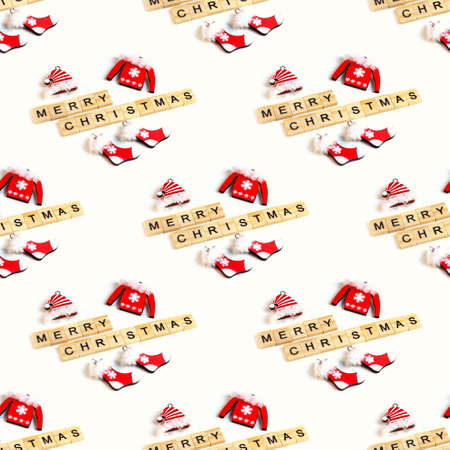 Xmas Santa Claus clothing with Merry Christmas text repeat seamless pattern on light background. Traditional winter holidays celebration design.の写真素材