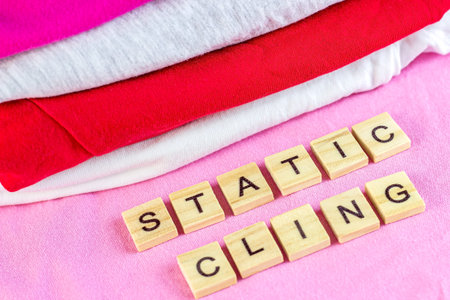 Bright dry stack of clothes with wooden words Static Cling.の写真素材