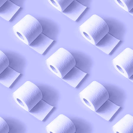 White toilet paper roll repeat seamless pattern on light blue Very Peri background.の写真素材