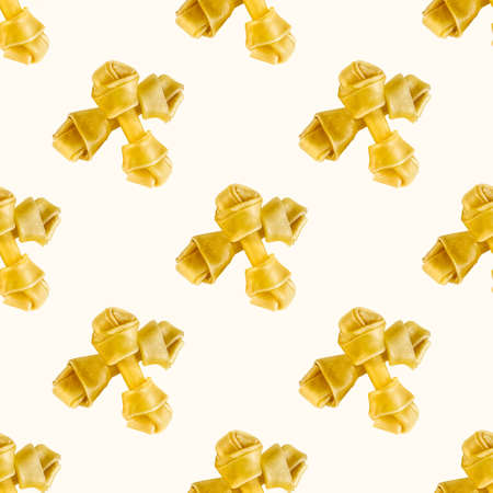 Knotted beef tendon bones for dog feed repeat seamless pattern on light background. Chewy treats for puppy.の写真素材
