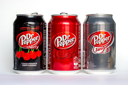 DUSHANBE, TAJIKISTAN - SEPTEMBER 12, 2022: Different kinds of a popular Dr. Pepper carbonated soda cans (Classic, Cherry and Zero) on white background.のeditorial素材